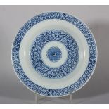 An 18th century London delft plate with chinoiserie scroll decoration, 9" dia, 1740