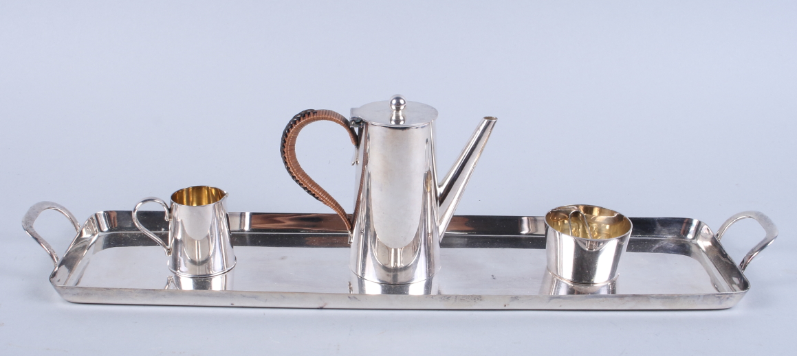 A miniature Art Deco silver plated four-piece teaset, including tray