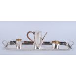 A miniature Art Deco silver plated four-piece teaset, including tray