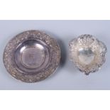 A late Victorian heart-shaped silver bonbon dish, embossed with flower and scroll decoration, and