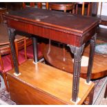 A late Georgian Irish mahogany fold-over top card table, with Gothic blind fret carving and