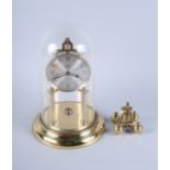 A boxed brass and glass anniversary clock