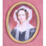 An early Victorian portrait miniature of an unknown woman with side curls and lace lappets, 3" x 2