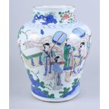 A Chinese Wucai porcelain baluster jar, decorated with figures in a garden court scene, 13" high
