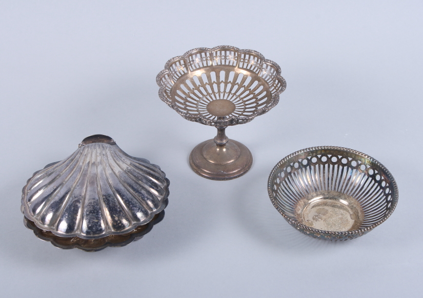 A silver pedestal sweetmeat basket with pierced decoration, a smaller similar bonbon dish and a