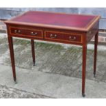 A late 19th century mahogany and banded writing desk with tooled lined top and two drawers, on