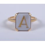 A 22ct gold signet ring set with hardstone, initialled with "A", ring size J