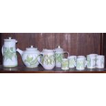 An Aldermaston pottery coffee set for six, three mugs, a matching teapot and a milk jug, decorated