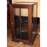 A mid 20th century mahogany and glass two-shelf display cabinet with single door, 24" high