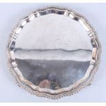 A late 20th century silver salver of Georgian design with pie crust rim and presentation