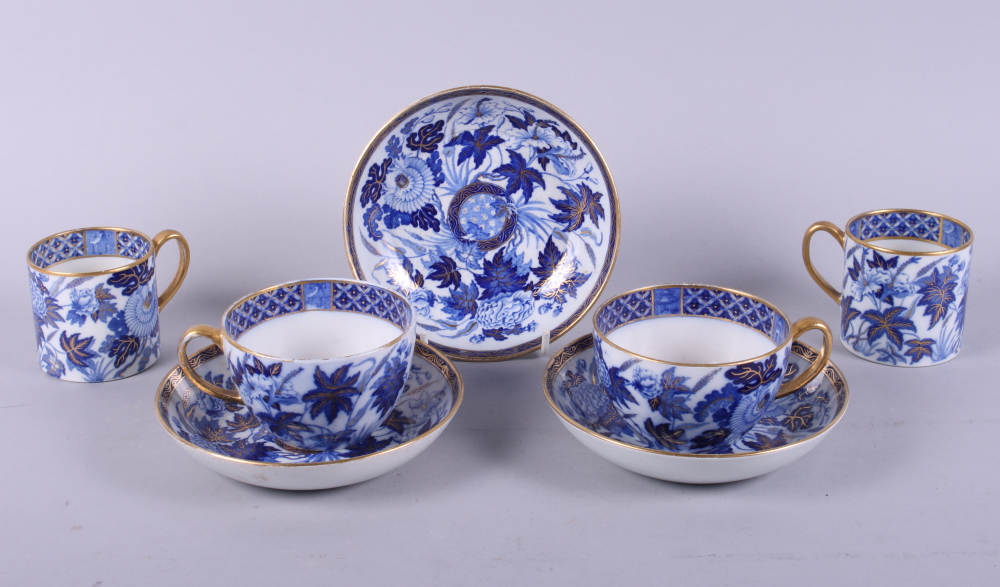 A pair of early 19th century Wedgwood pottery blue and white floral decorated tea cups and saucers