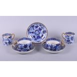 A pair of early 19th century Wedgwood pottery blue and white floral decorated tea cups and saucers