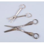 A pair of Victorian silver handled grape scissors and a pair of silver plate grape scissors