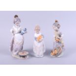 Three Lladro figures, "Valencian Girl", Miss Valencia" and "Making Paella", tallest 8 3/4" high