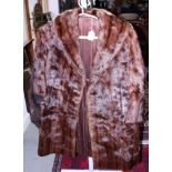 A three-quarter length mink musquash fur coat (wear by hook), a mink short jacket (slight moth