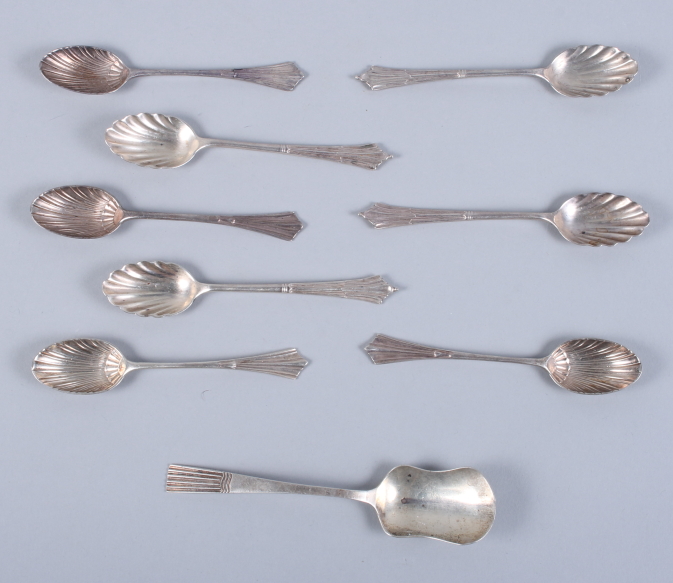 Two sets of four silver teaspoons, each with shell formed bowls, and a silver sugar scoop, 3.8oz