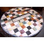 A late 18th century specimen marble table top with central carved Carrara marble panel of