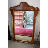 A burr walnut and gilt mirror of early 18th century design, plate size 29 1/2" x 17 1/2"