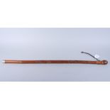 An early 20th century Japanese carved bamboo walking cane with fish decoration, 34" long