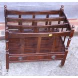 A polished as mahogany canterbury, fitted one drawer, on square castored supports, 22" wide