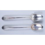 A pair of Georgian bottom marked silver basting spoons with bright cut decoration, 4.3oz troy approx