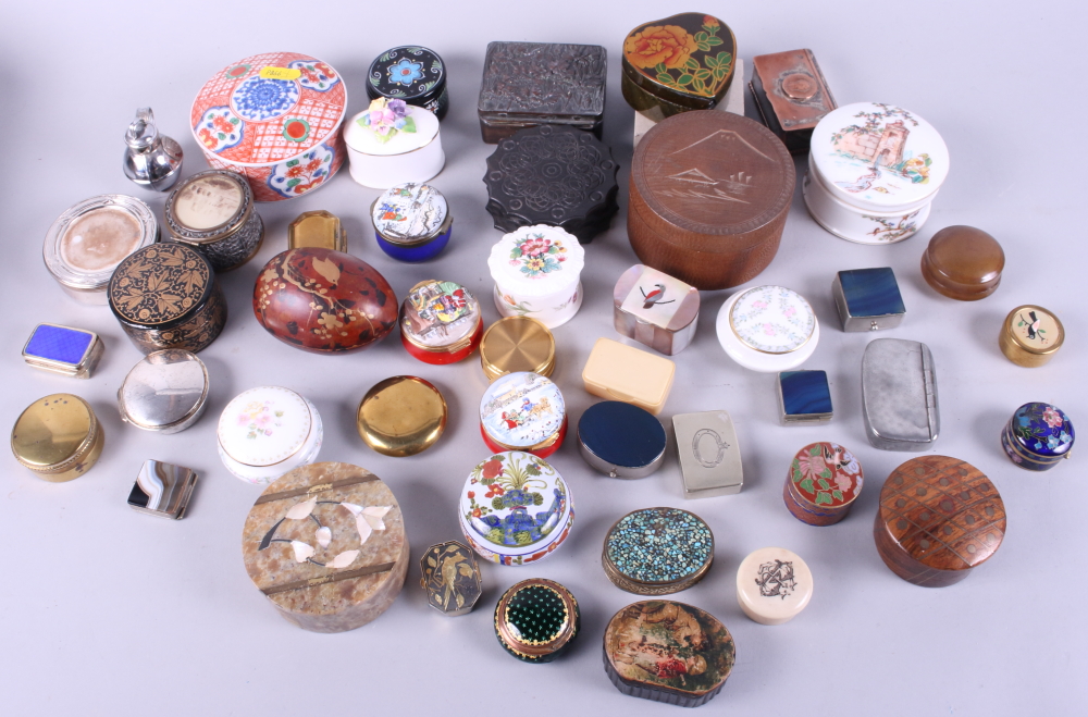 A collection of enamel, china, metal and wood pillboxes and trinket boxes
