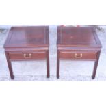 A pair of early 20th century Chinese rosewood bedside tables, fitted drawer with brass handle, on