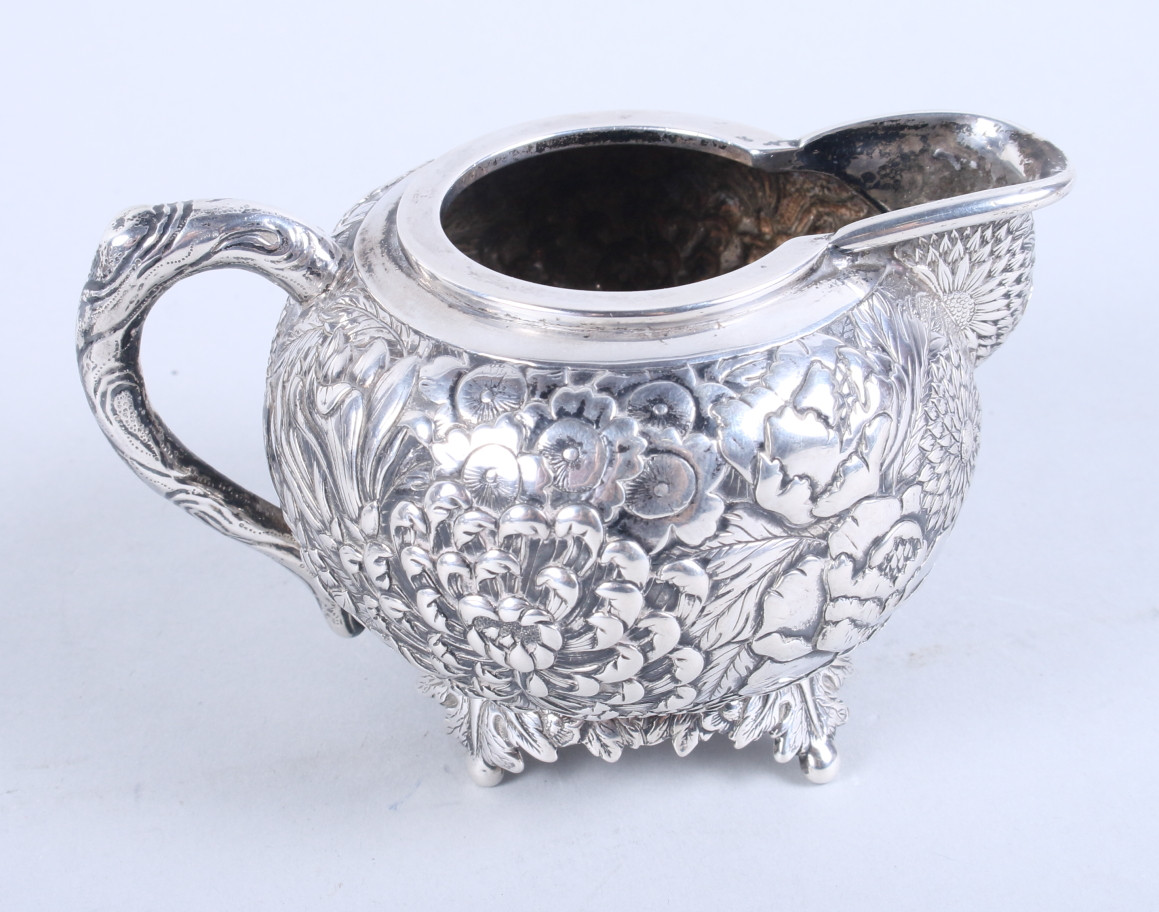 An early 20th century Chinese silver three-piece teaset, by Wang Hing, with embossed all-over floral - Image 12 of 13