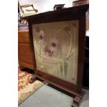 An early 20th century mahogany framed embroidered fire screen, 37" wide, a brass framed triple-panel