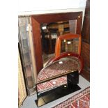An Ercol leather backed wall mirror and various other wall mirrors