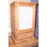 A pine side cabinet, fitted glazed door over fall front drawer, 22" wide