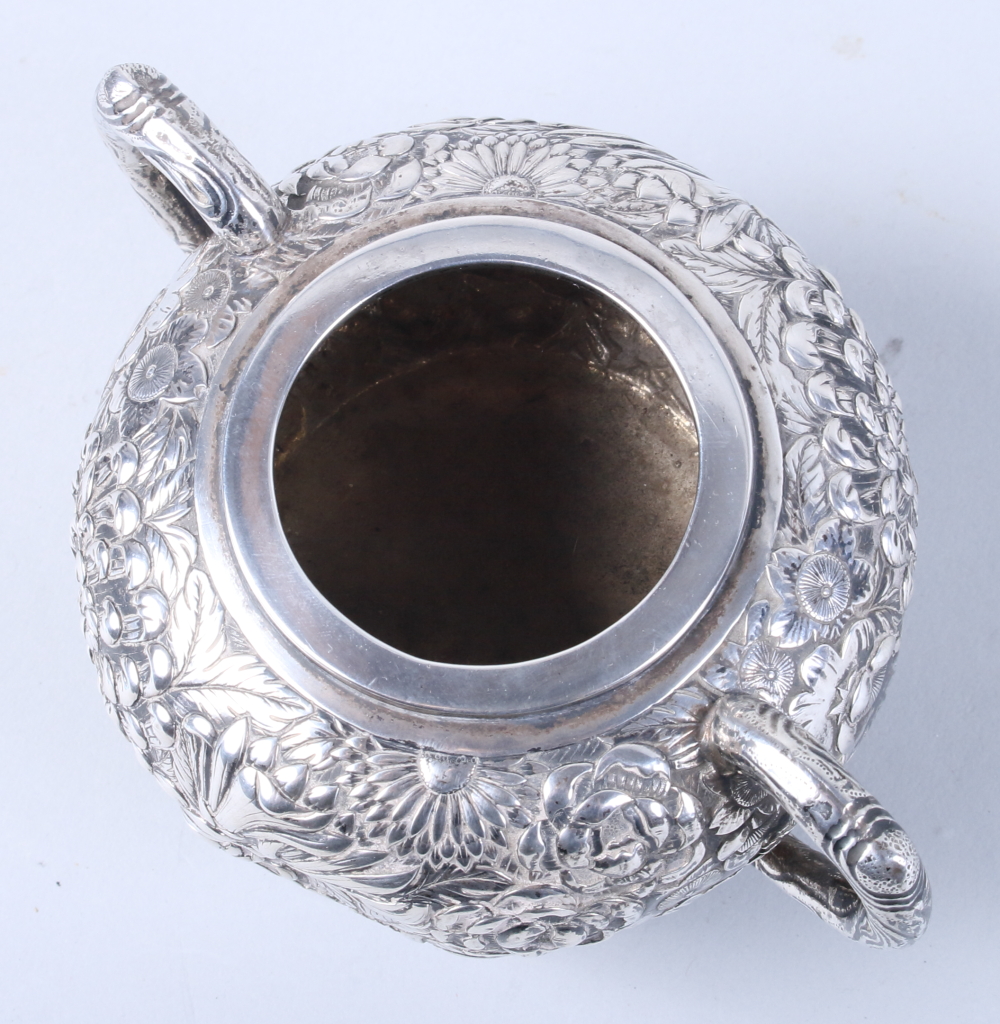 An early 20th century Chinese silver three-piece teaset, by Wang Hing, with embossed all-over floral - Image 5 of 13