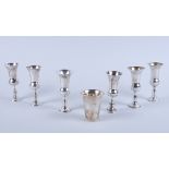 A matched set of six George V Jewish silver Kiddush goblets and a matching Kiddush silver beaker,
