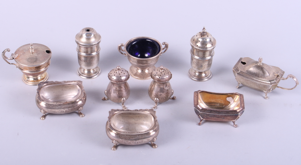 An assortment of part silver cruet sets, including mustards, pepperettes, salts, etc, 13oz troy