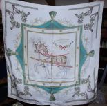 A Hermes silk scarf "Harnais Francais Premier Empire" designed by Hugo Grygkar; and another Hermes