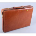 A leather attache case by Hendys of London