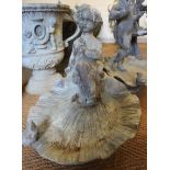 A cast lead garden shell-shape bird bath with putto, 16" high