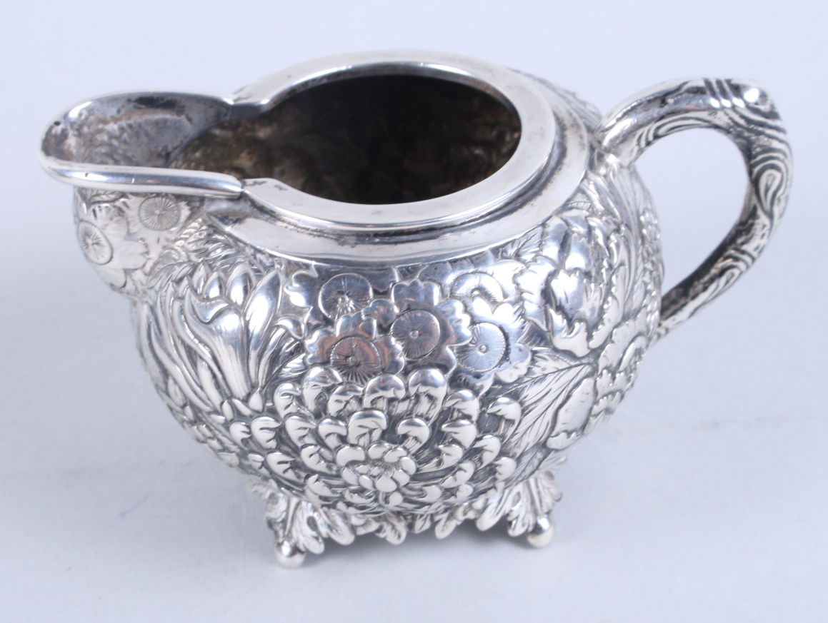 An early 20th century Chinese silver three-piece teaset, by Wang Hing, with embossed all-over floral - Image 11 of 13