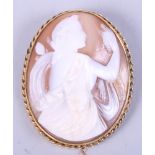 An oval carved shell cameo in 9ct gold brooch mount