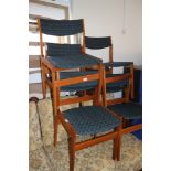 A set of six Danish design teak dining chairs, upholstered in a retro design fabric