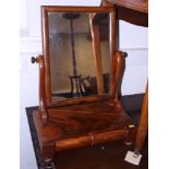 A mid Victorian swing frame toilet mirror, on platform base, fitted two drawers, and squat bun feet,