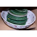 A collection of green glazed leaf and other plates and a rose decorated toilet bowl