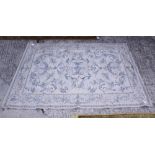 A flat weave rug of 18th century design with all-over scroll pattern on a cream ground, 72" x 52"