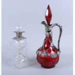 A Victorian silver plated mounted claret jug, cast with vine and grape decoration, 15" high, and a