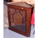 A mahogany corner cabinet enclosed astragal glazed door, 27" wide, and an Edwardian mahogany