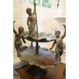 A cast lead two-tier shell-shape fountain with figures, 36" high