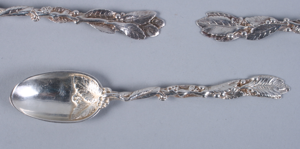 A matched set of ten Victorian silver teaspoons with leaf and flower decorated handles and crest - Image 2 of 3