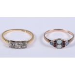 A German 8ct gold, opal and garnet dress ring, size O, 1.4g, and a 18ct gold, platinum and diamond
