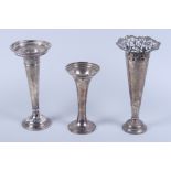 A late Victorian loaded silver conical shaped vase, on stepped circular foot, 9 3/4" high, and two