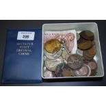 A quantity of loose coins, notes and medals, including a WWII medal and a commemorative medal for